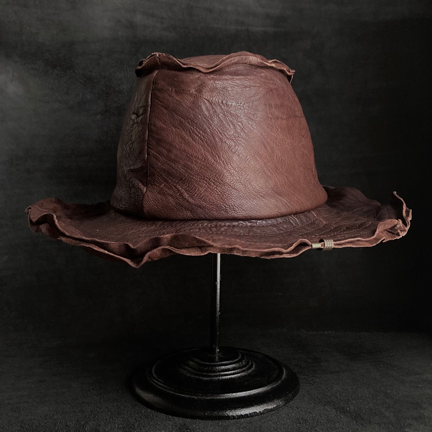 Wrinkled deep brown leather fedora hat