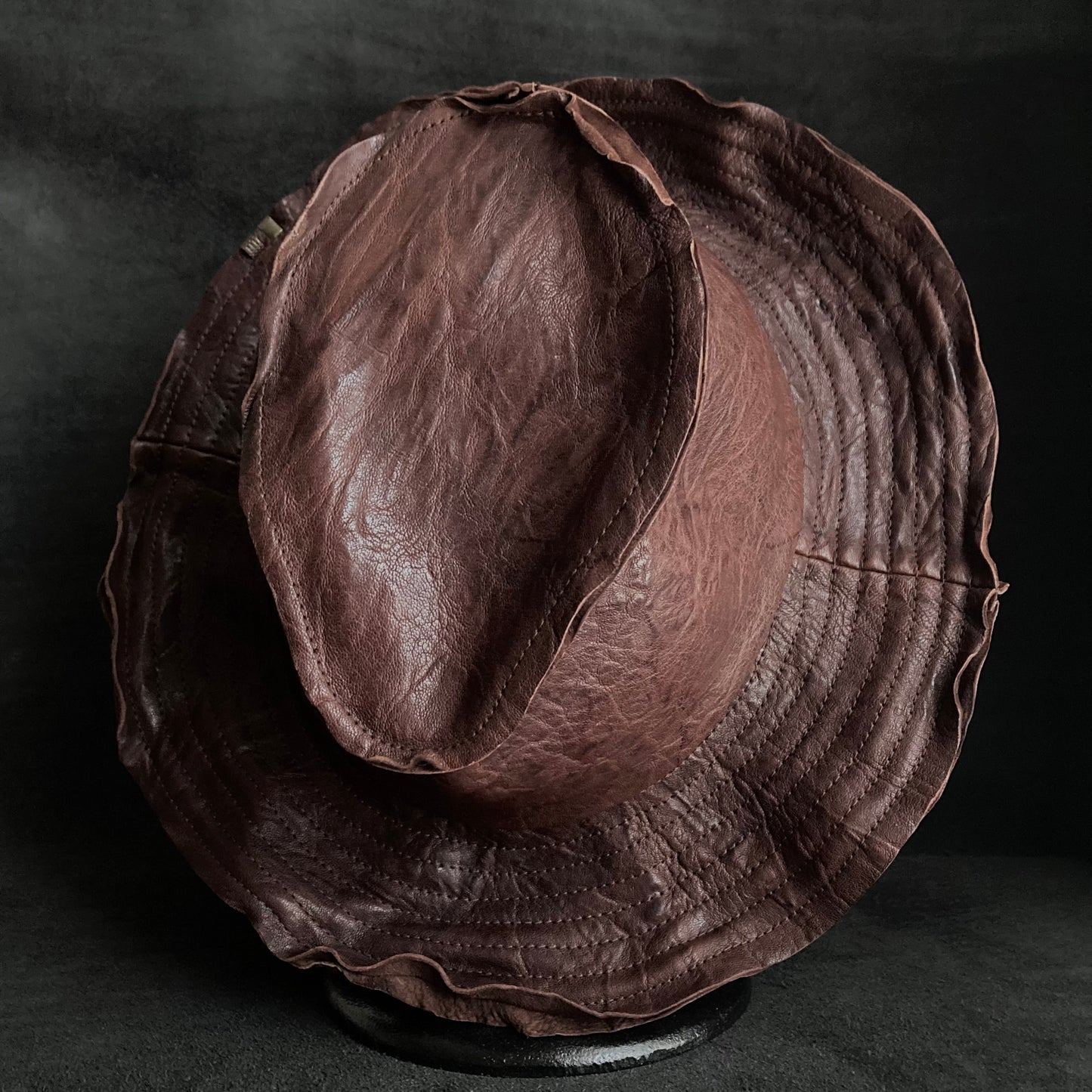 Wrinkled deep brown leather fedora hat