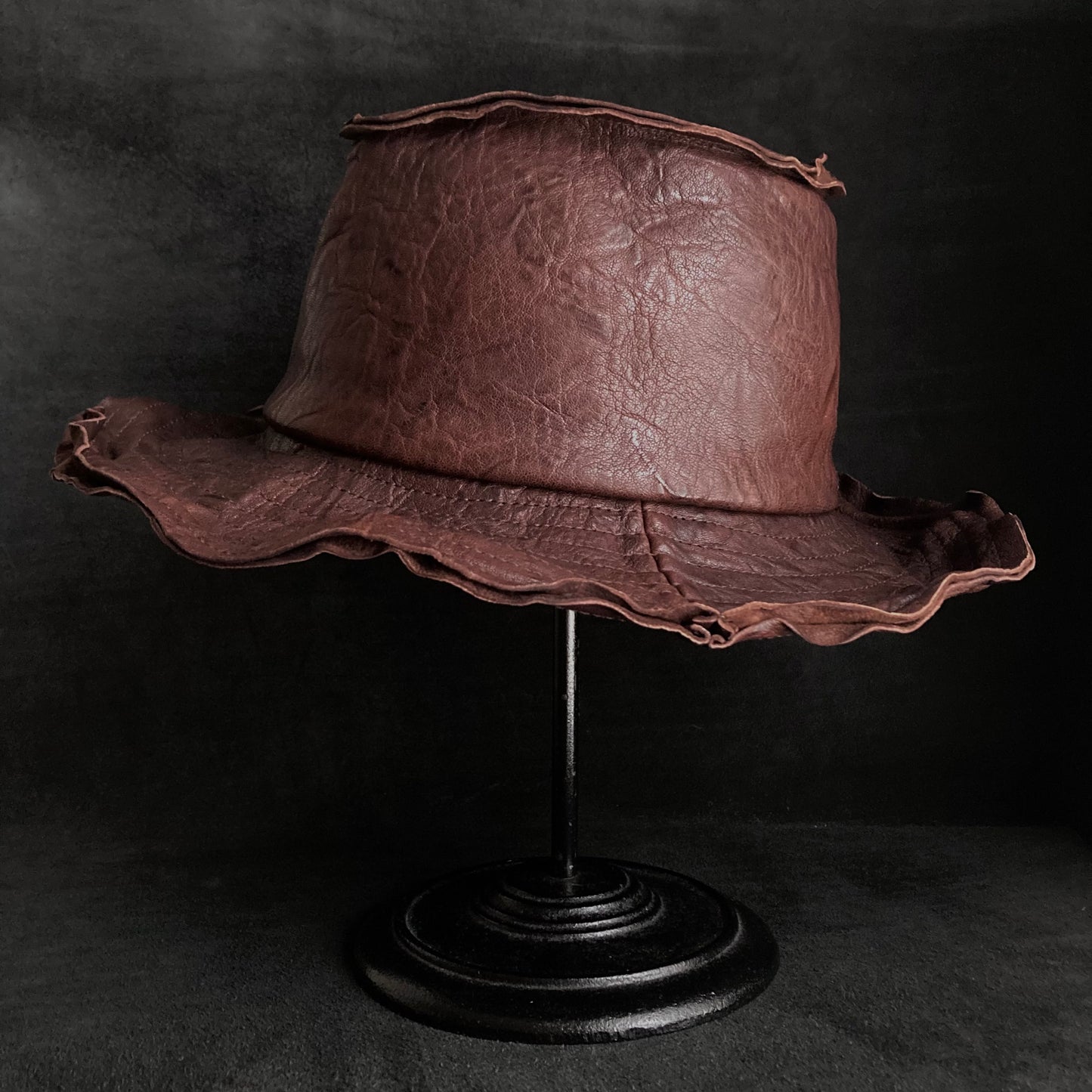 Wrinkled deep brown leather fedora hat