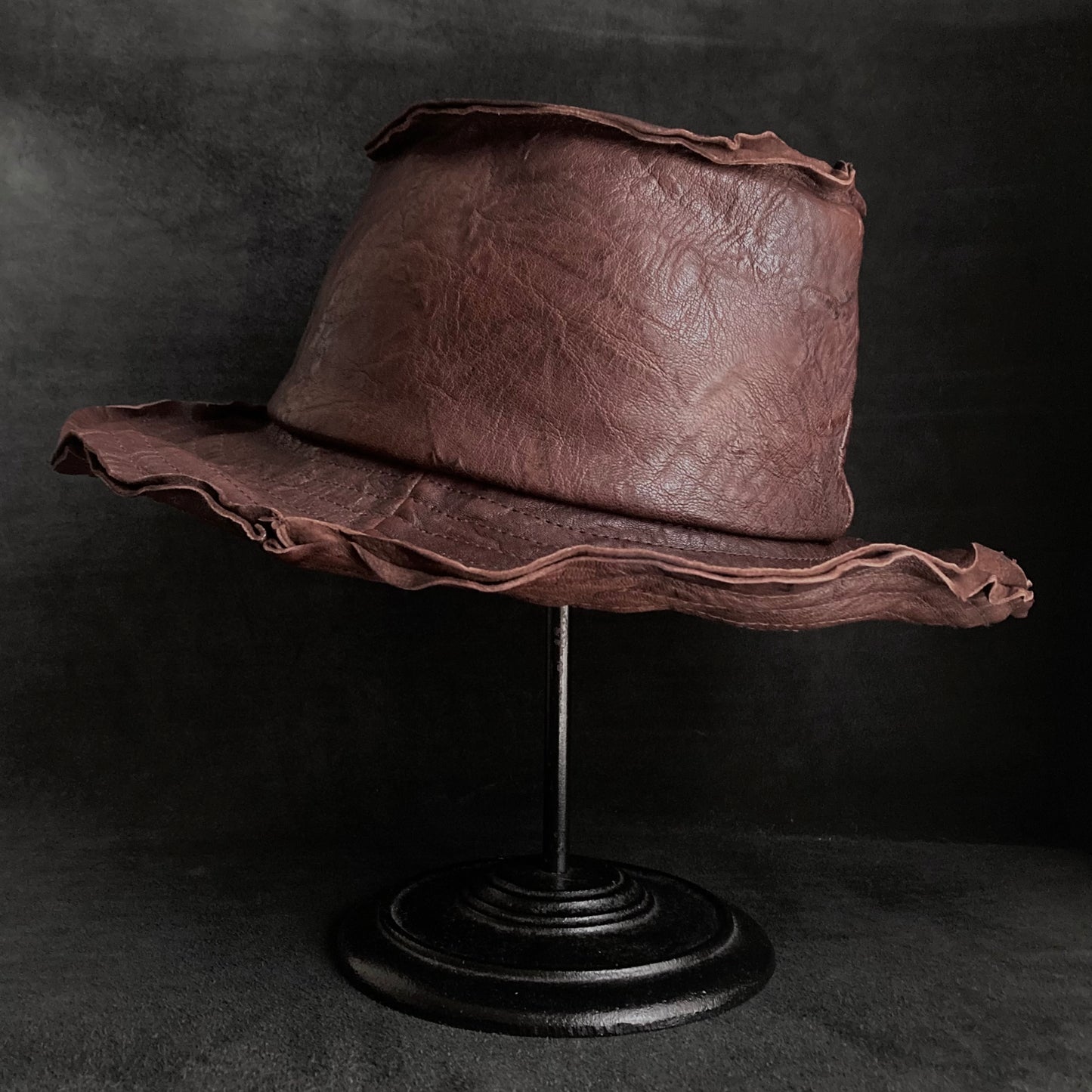 Wrinkled deep brown leather fedora hat
