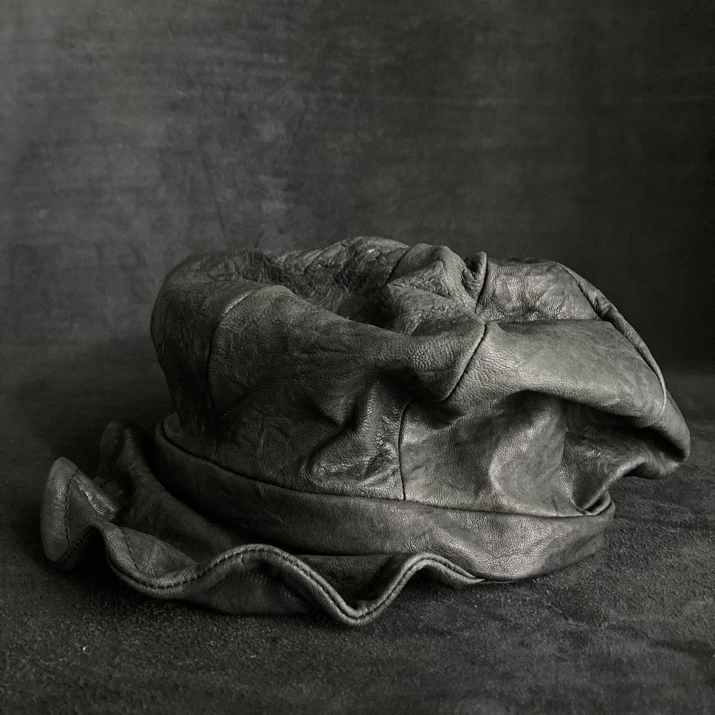 Wrinkled soft black leather casquette