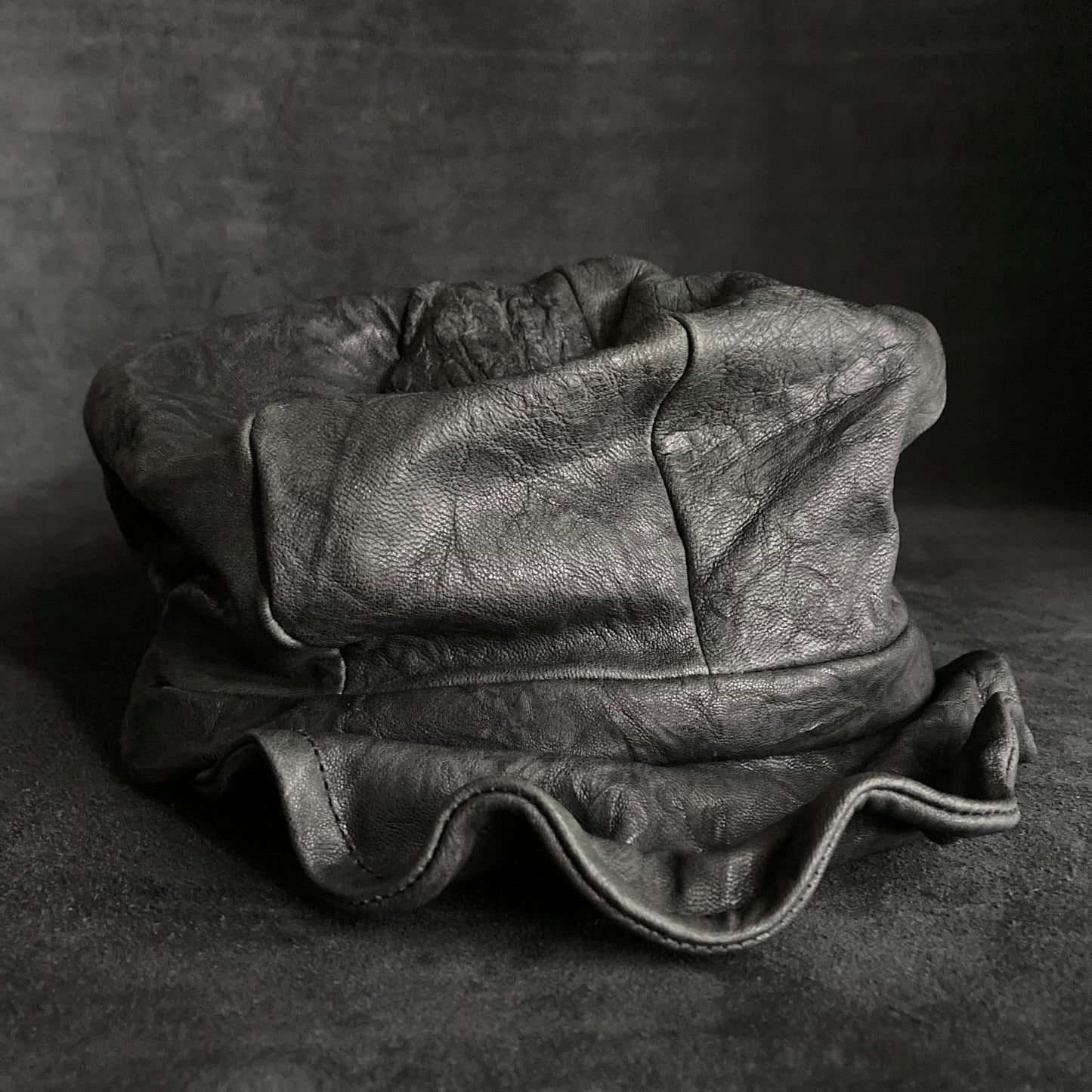 Wrinkled soft black leather casquette