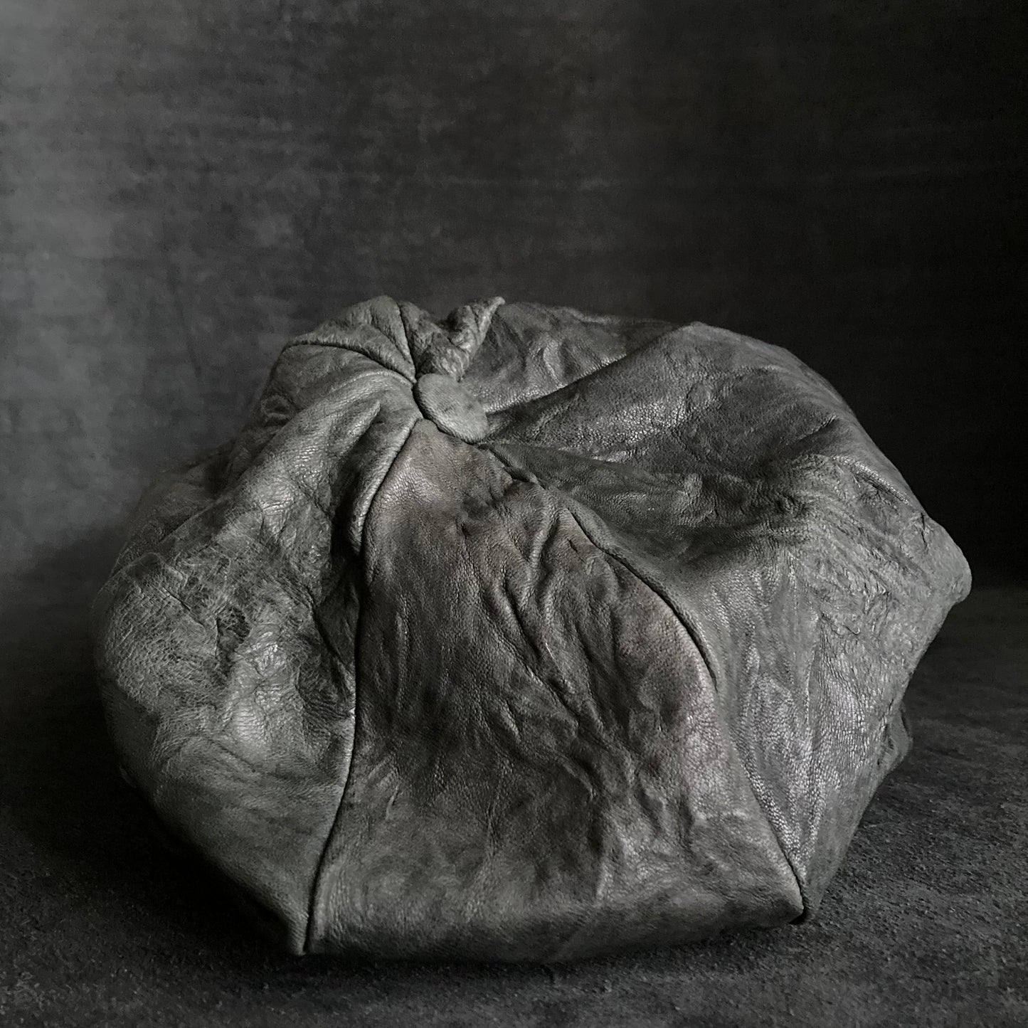 Wrinkled soft black leather casquette