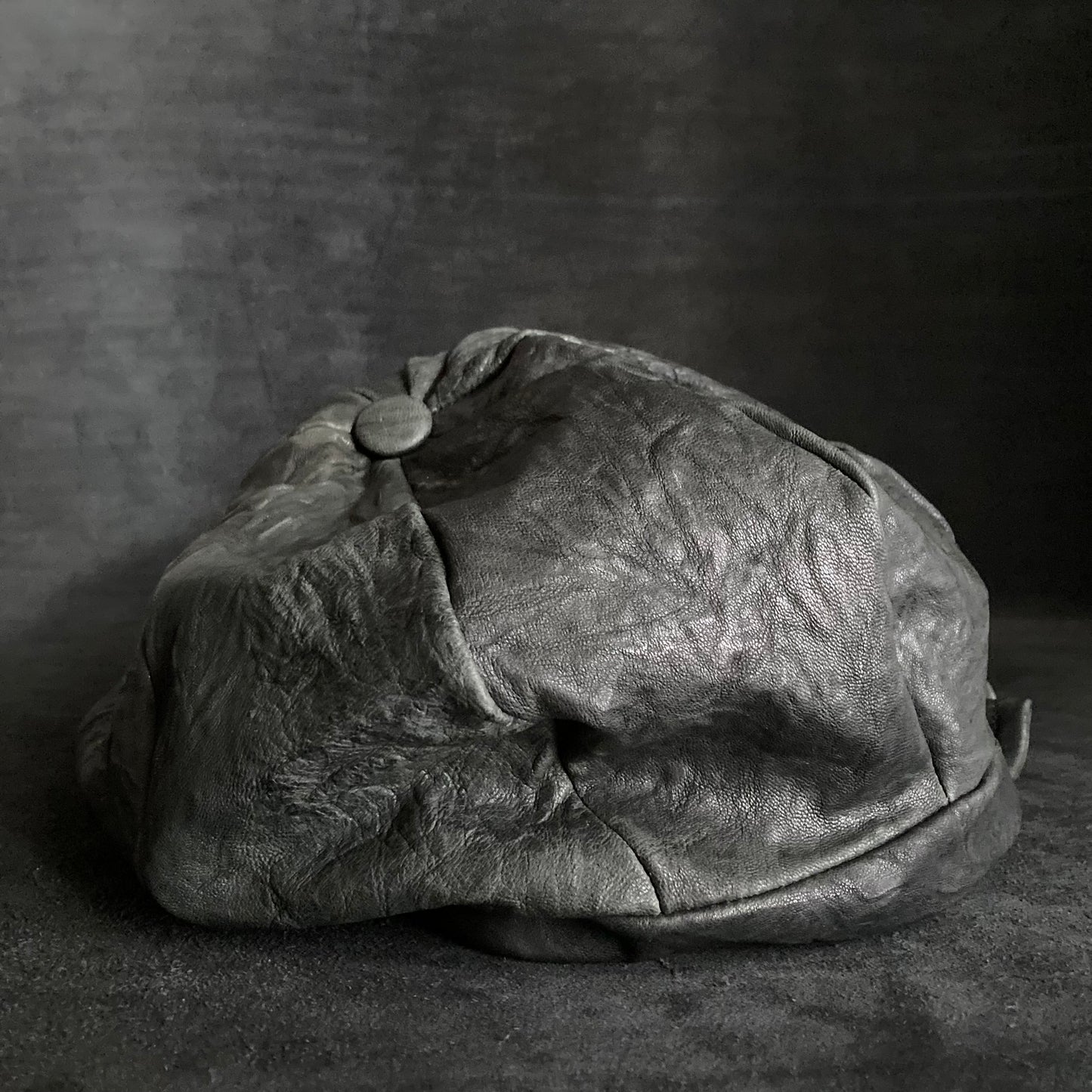 Wrinkled soft black leather casquette