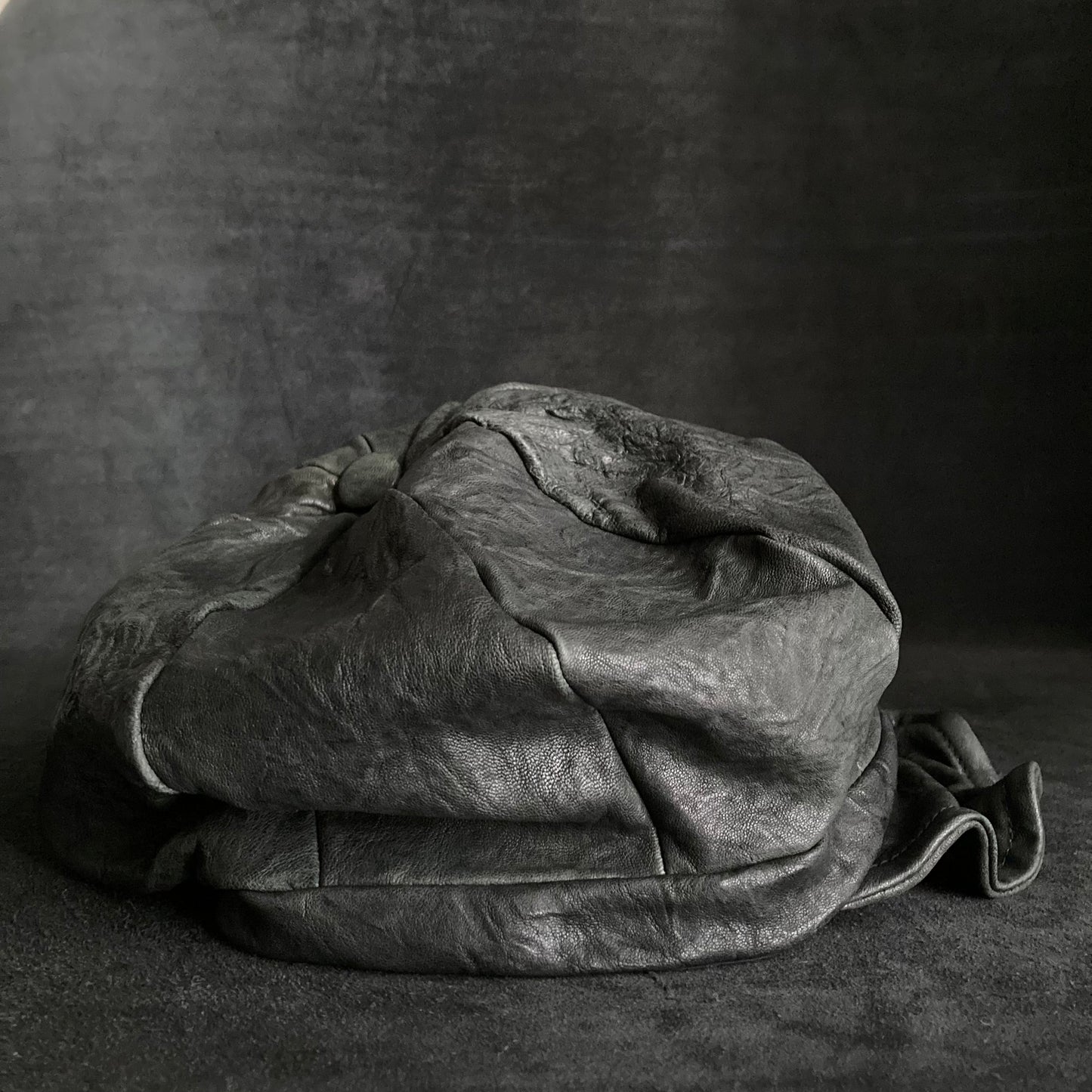 Wrinkled soft black leather casquette