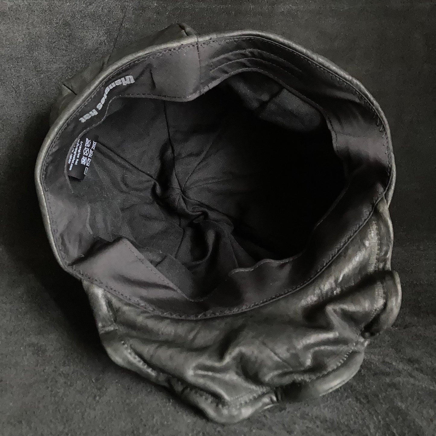 Wrinkled soft black leather casquette