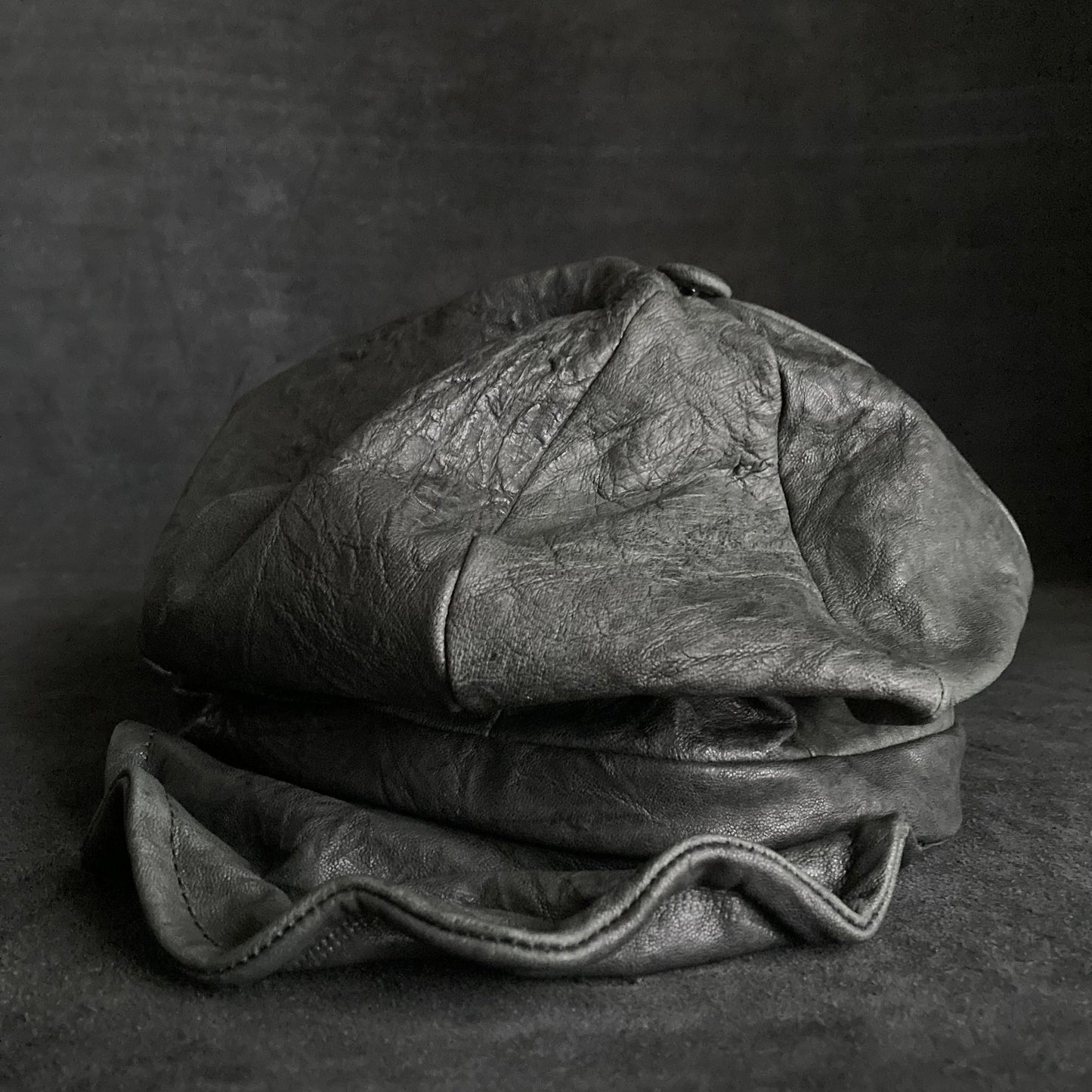 Wrinkled soft black leather casquette