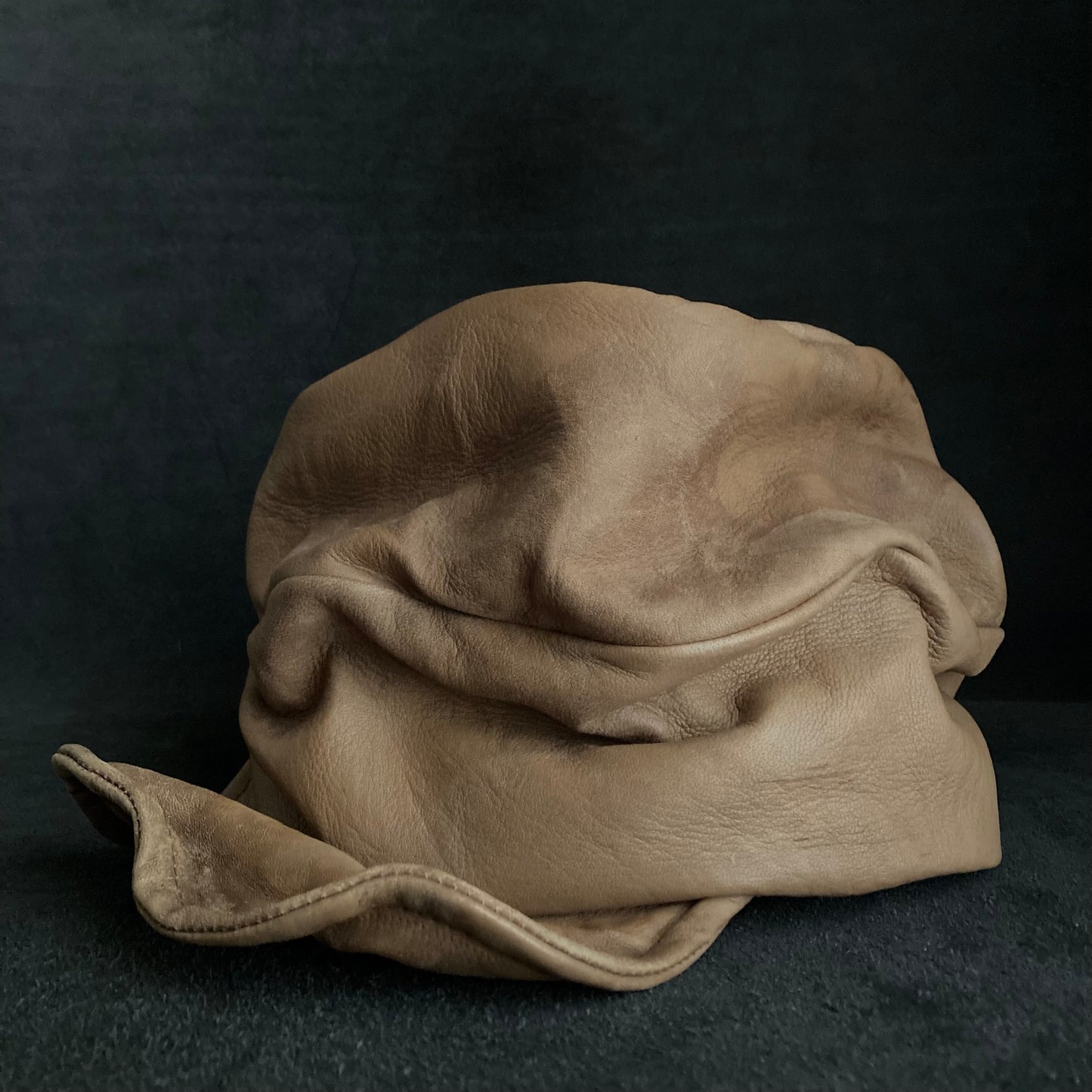 Irregularly dyed light brown leather turn cap