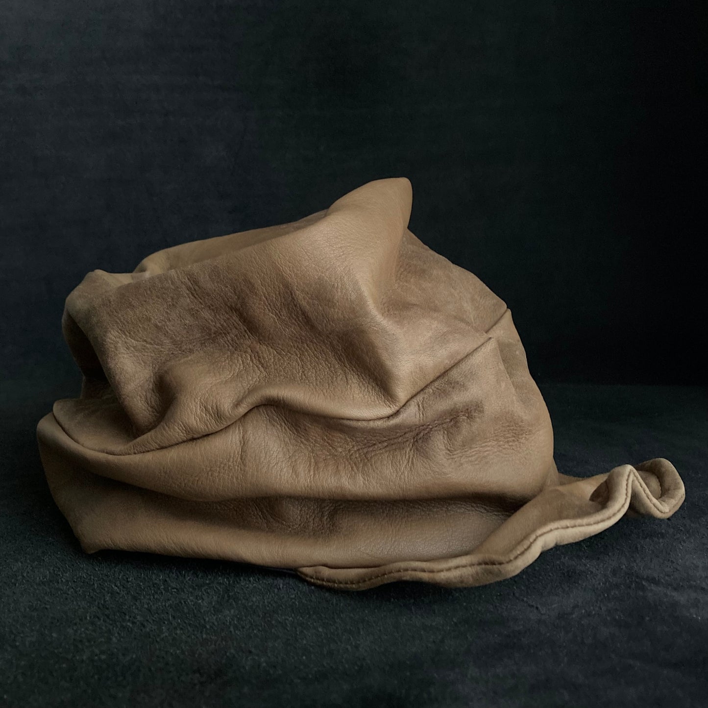 Irregularly dyed light brown leather turn cap