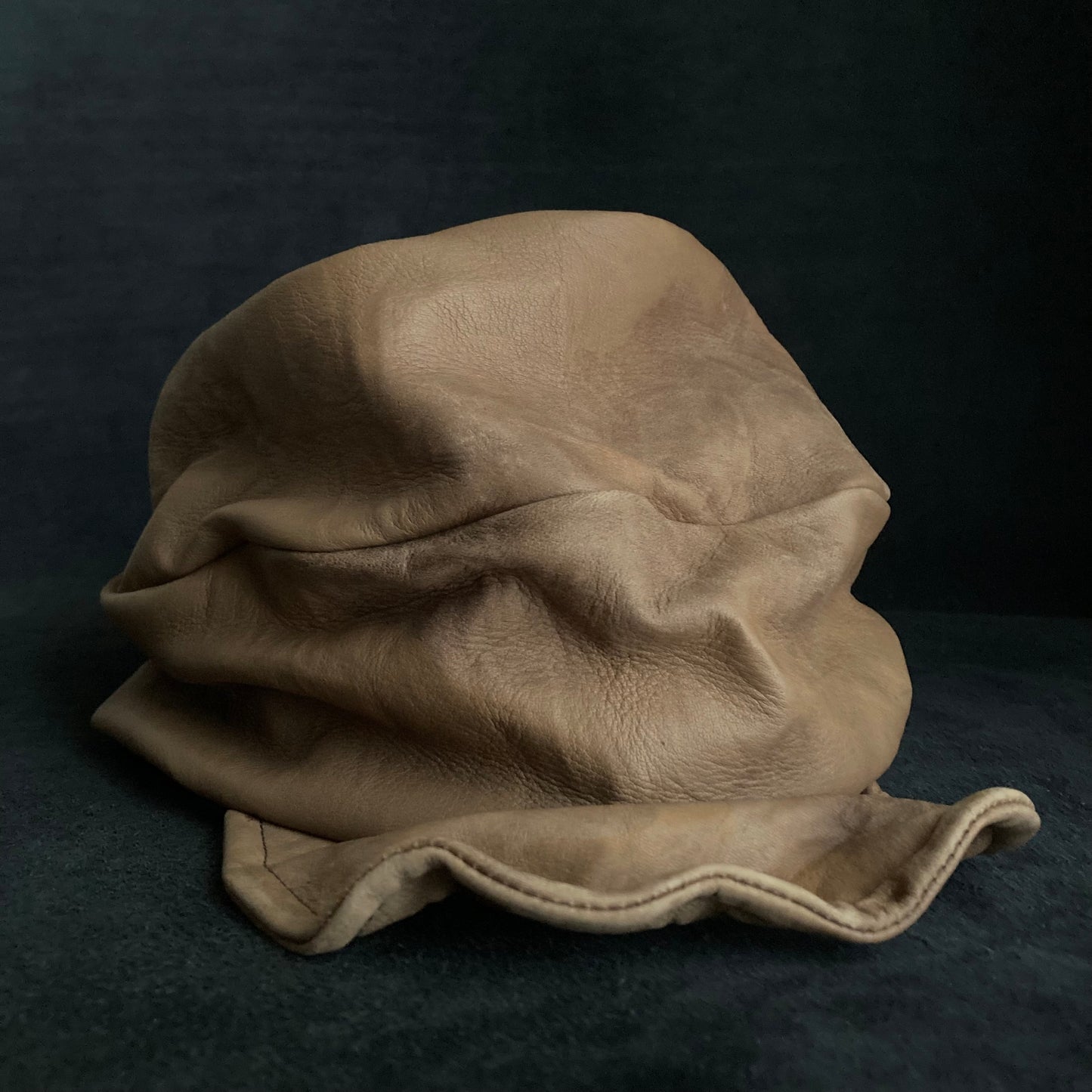 Irregularly dyed light brown leather turn cap