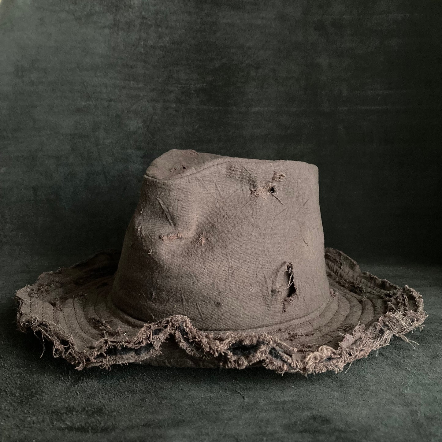 Fraying  damage  brown cotton-linen fedora hat