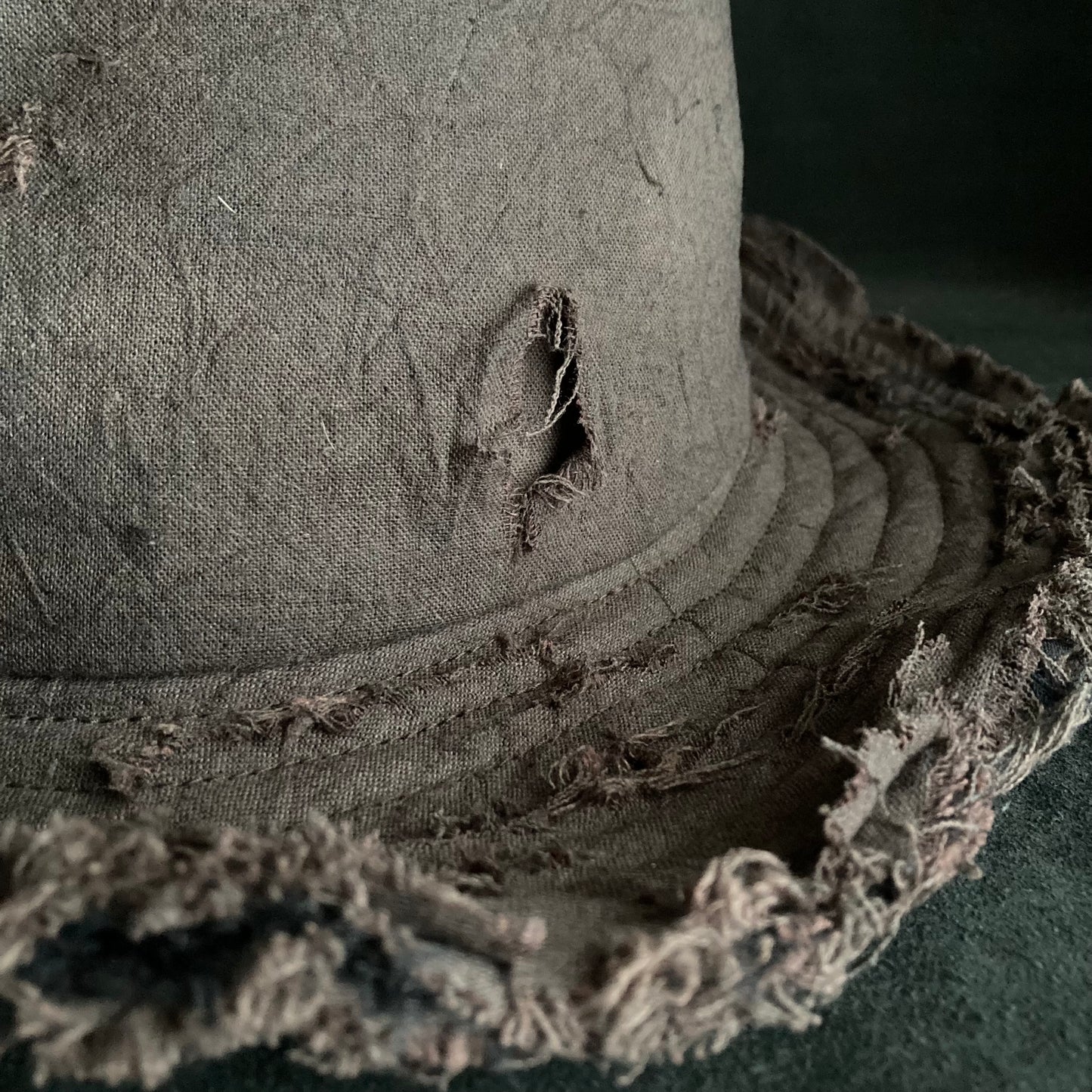 Fraying  damage  brown cotton-linen fedora hat