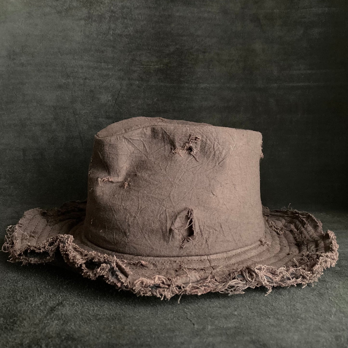 Fraying  damage  brown cotton-linen fedora hat