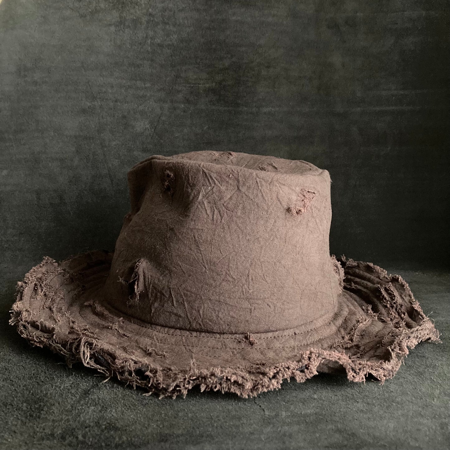 Fraying  damage  brown cotton-linen fedora hat