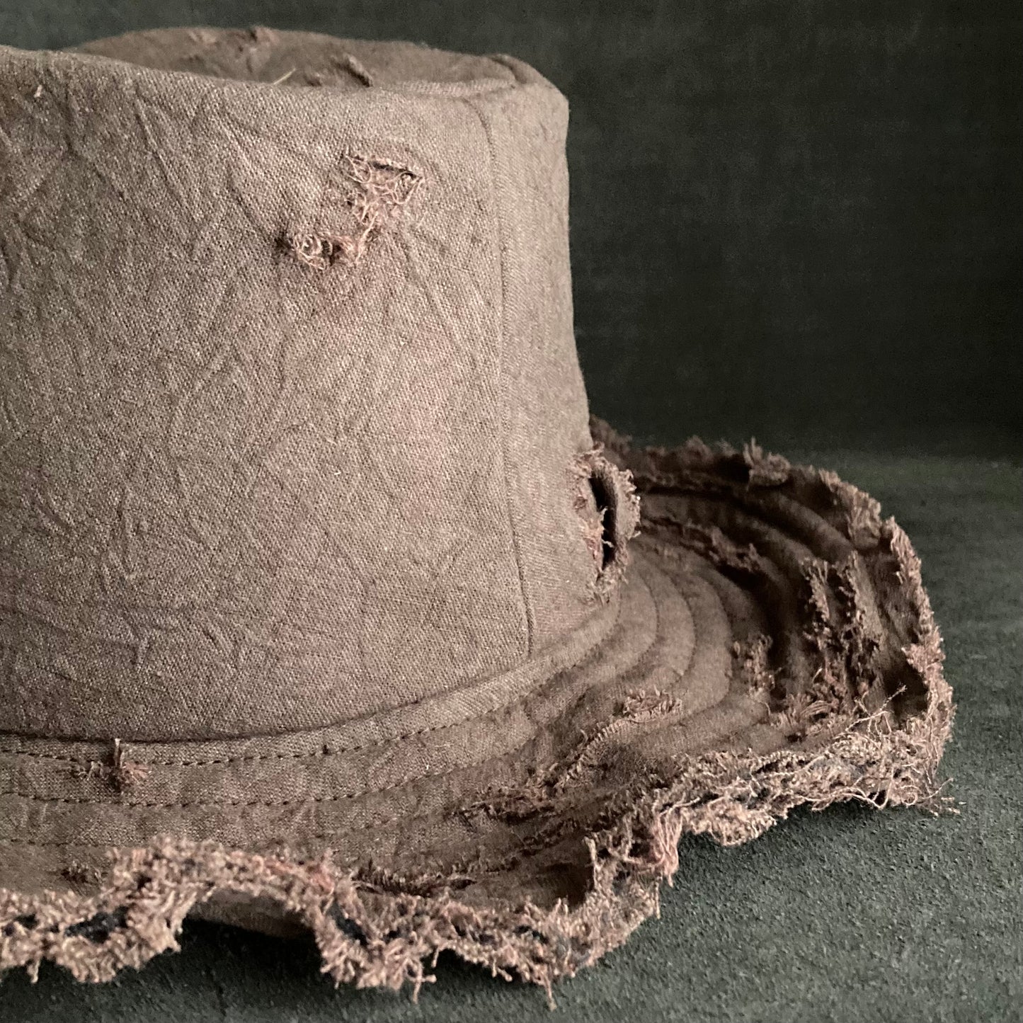 Fraying  damage  brown cotton-linen fedora hat