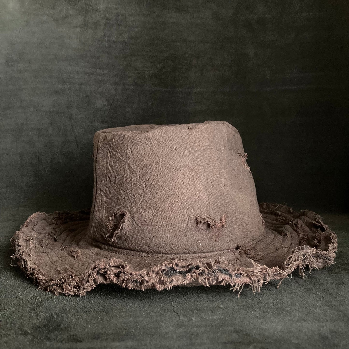 Fraying  damage  brown cotton-linen fedora hat