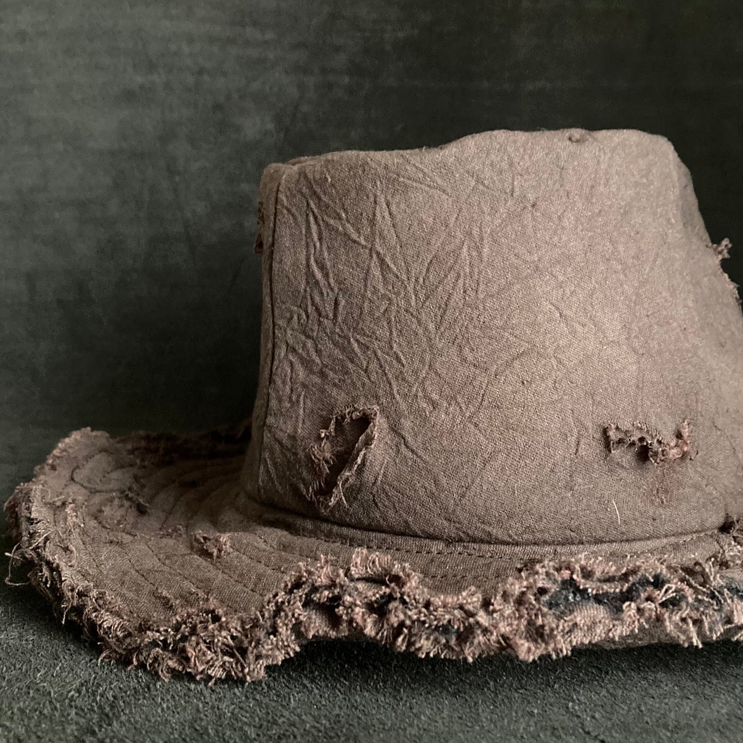 Fraying  damage  brown cotton-linen fedora hat