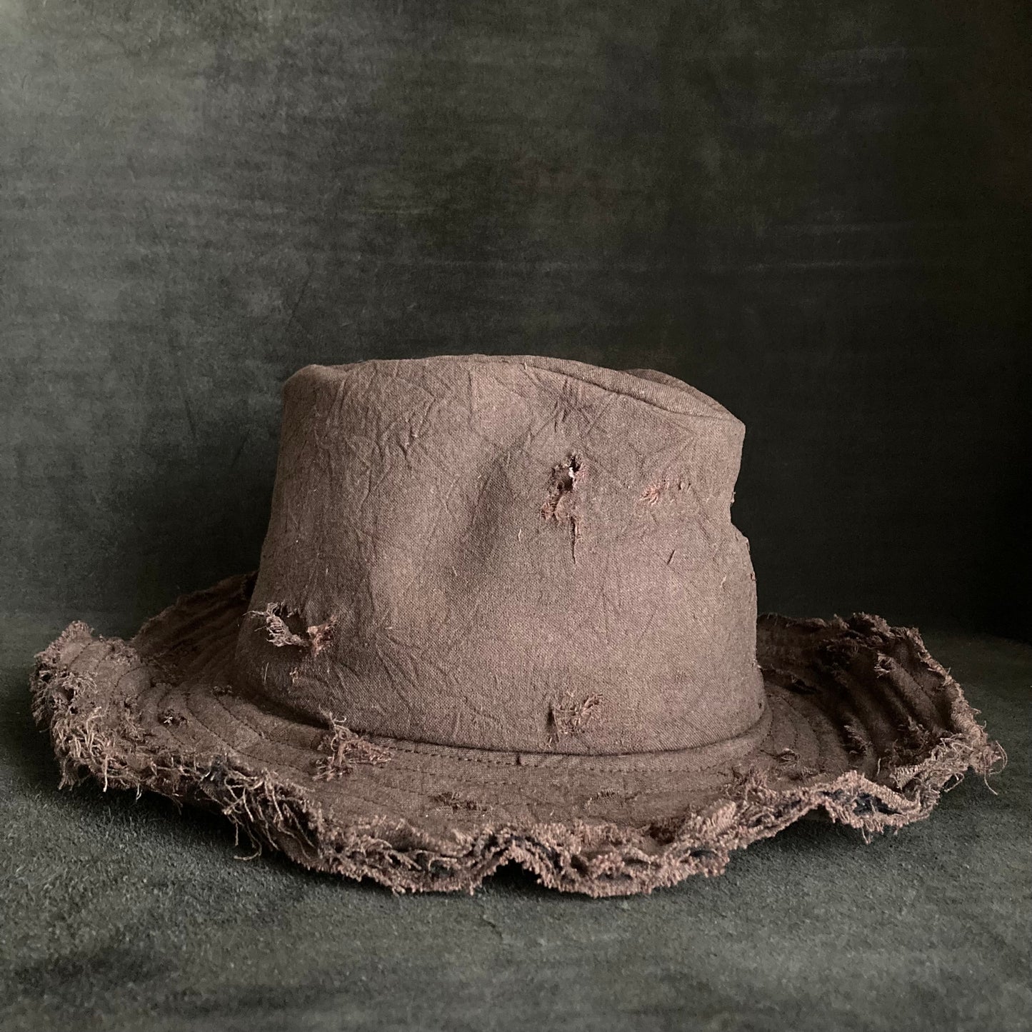 Fraying  damage  brown cotton-linen fedora hat