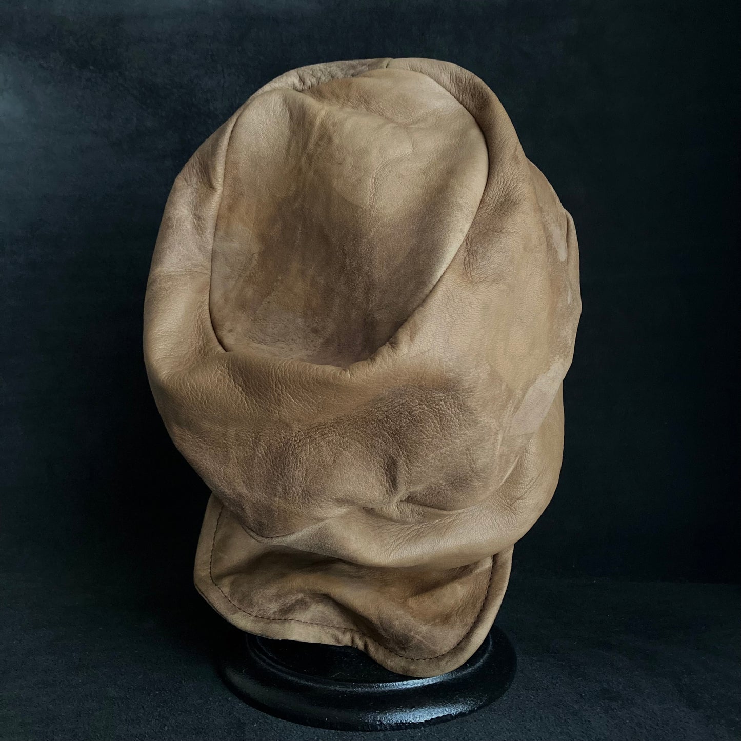 Irregularly dyed light brown leather turn cap