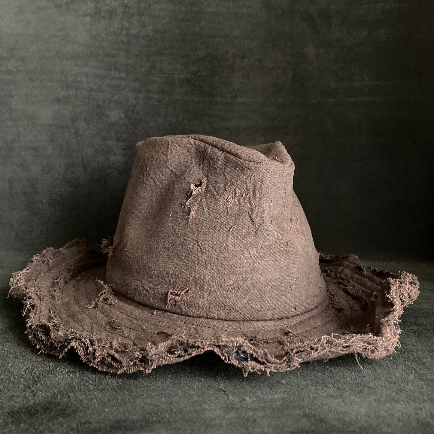 Fraying  damage  brown cotton-linen fedora hat