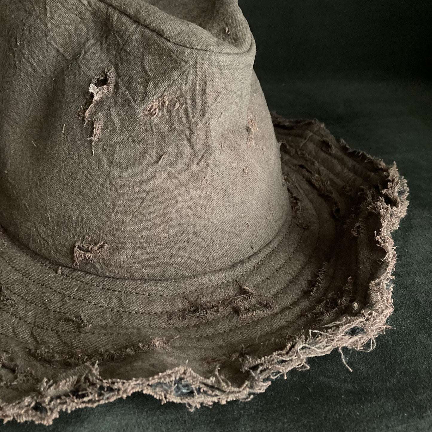 Fraying  damage  brown cotton-linen fedora hat