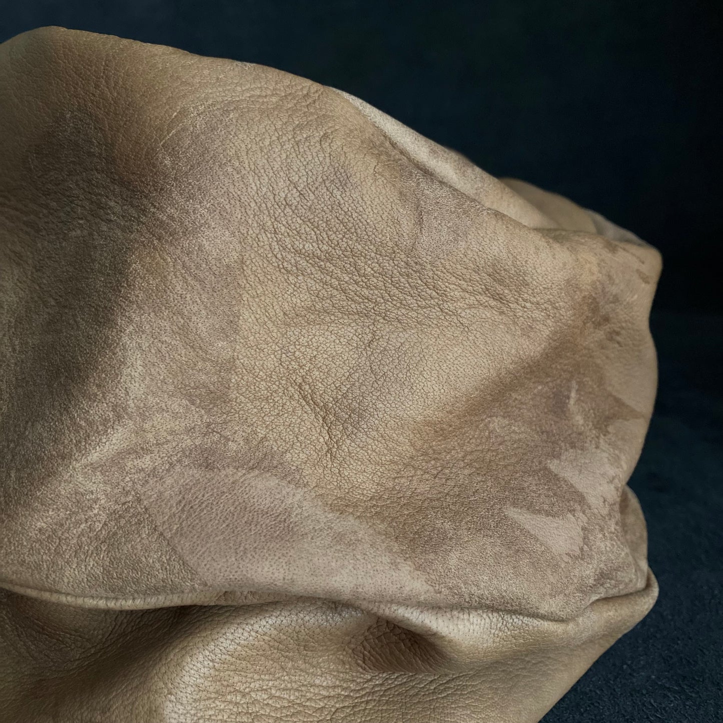 Irregularly dyed light brown leather turn cap