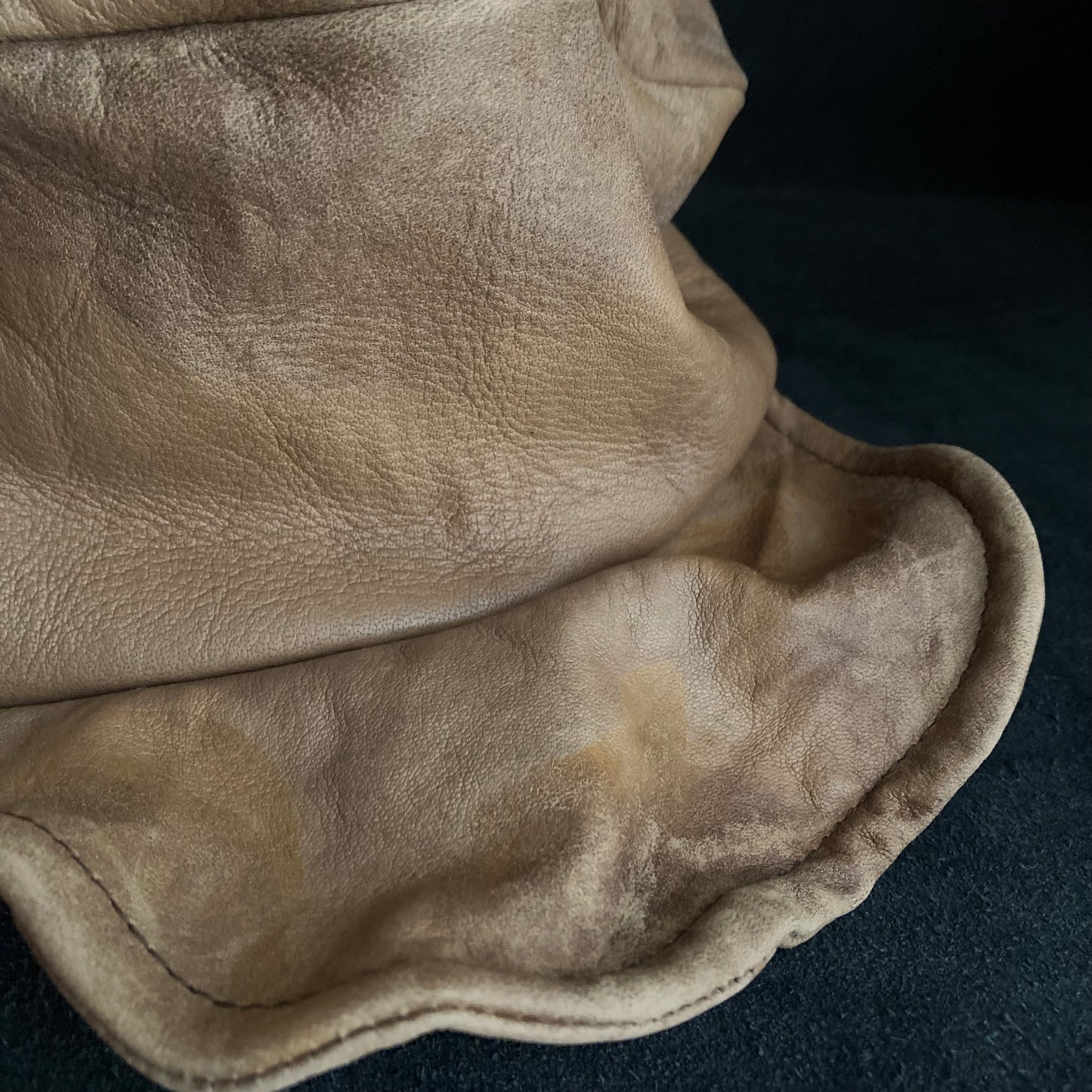 Irregularly dyed light brown leather turn cap