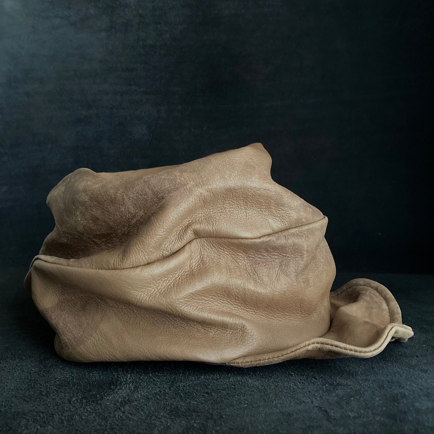 Irregularly dyed light brown leather turn cap