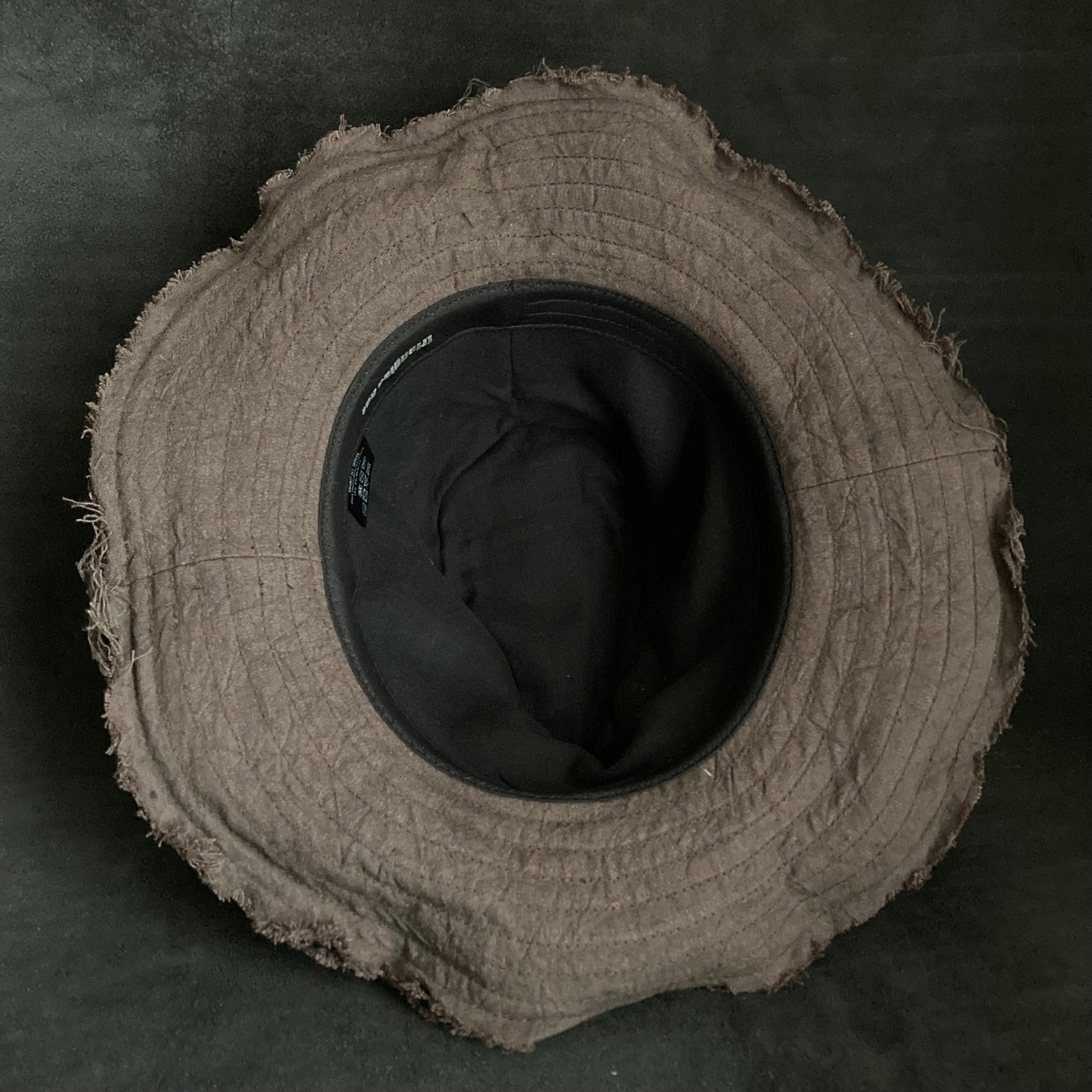 Fraying  damage  brown cotton-linen fedora hat