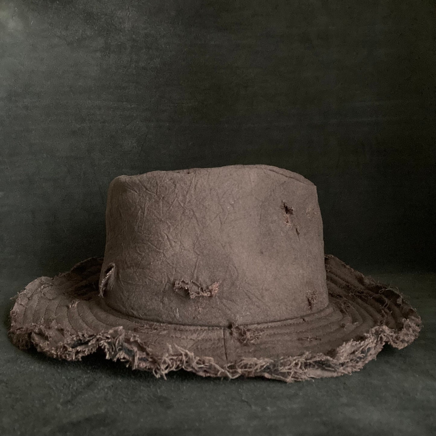 Fraying  damage  brown cotton-linen fedora hat