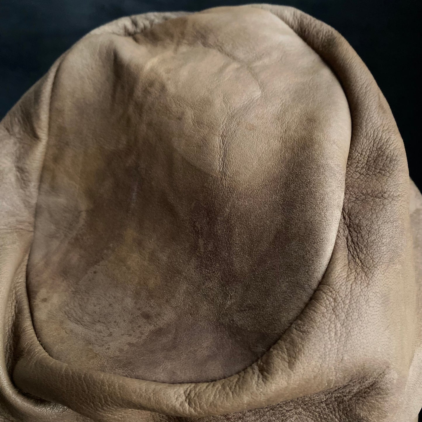 Irregularly dyed light brown leather turn cap