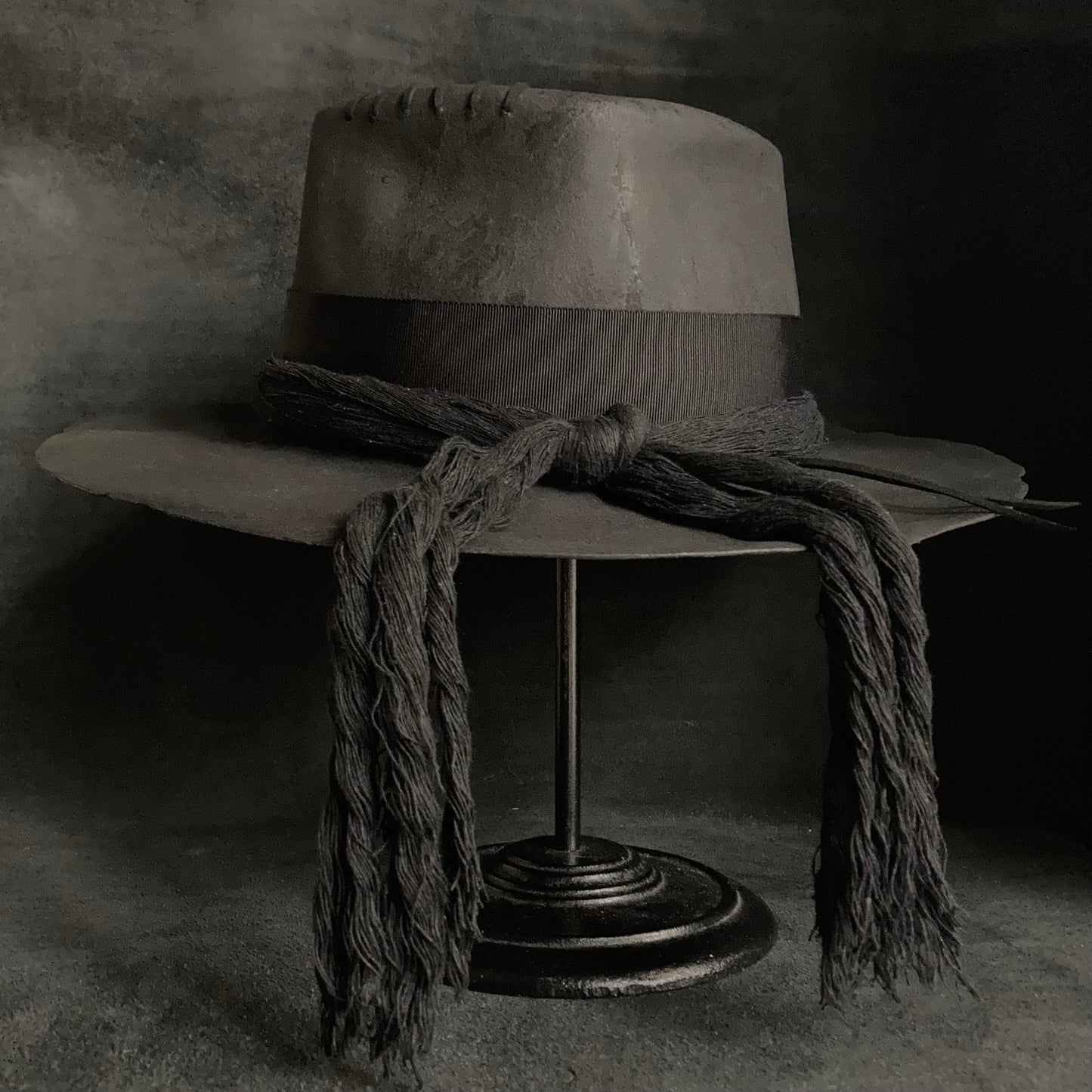 Charcoal cord around diamond hat