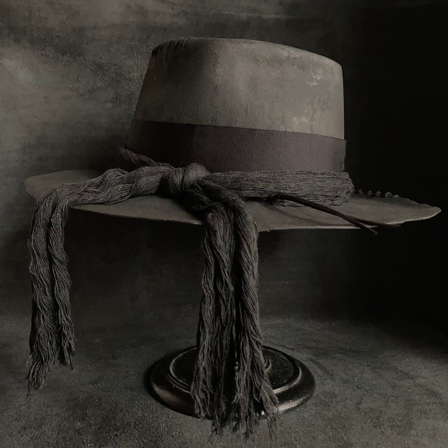 Charcoal cord around diamond hat