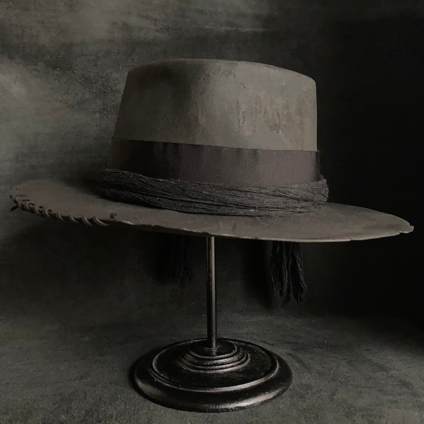 Charcoal cord around diamond hat