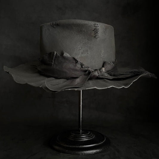 Charcoal rusty decaying fedora hat