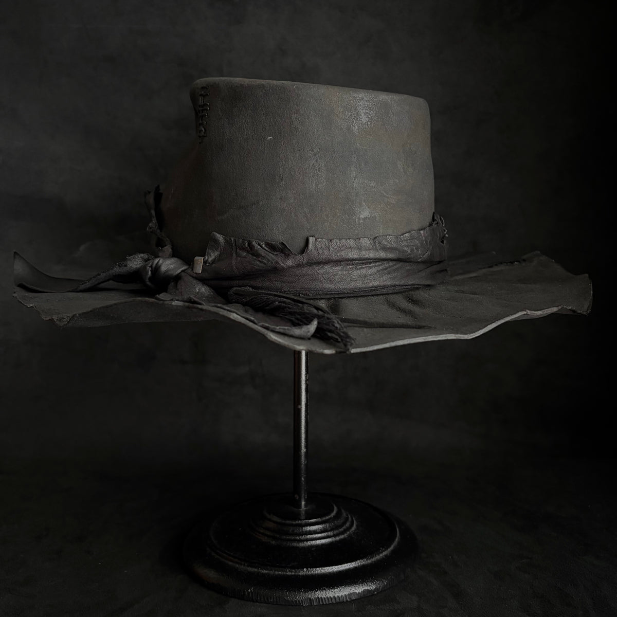 Charcoal rusty decaying fedora hat